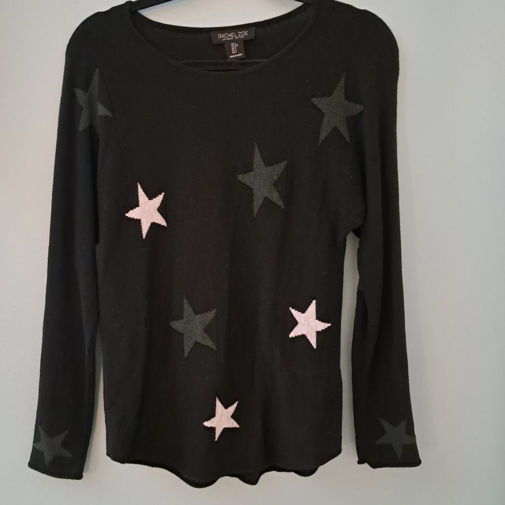 Like new Rachel Zoe star sweater. Cute stars on wrist and behind elbows.